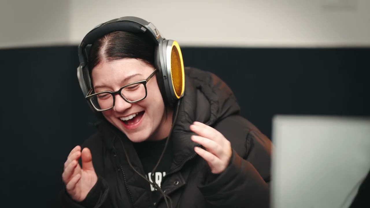 Woman with headphones smiling joyfully — Sonova hearing healthcare brand commercial video production by Origin Films Toronto